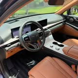 Driver seat and steering wheel with brown leather interior